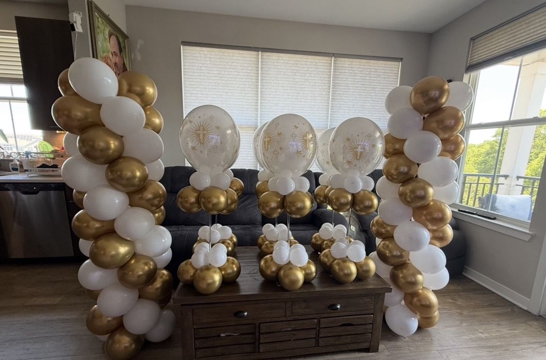 Gold and white balloon columns and centerpieces