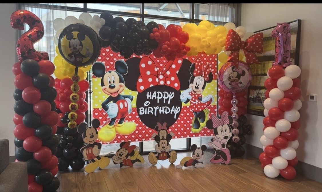 Mickey and Minnie birthday backdrop with number 2 and number 1 balloon columns